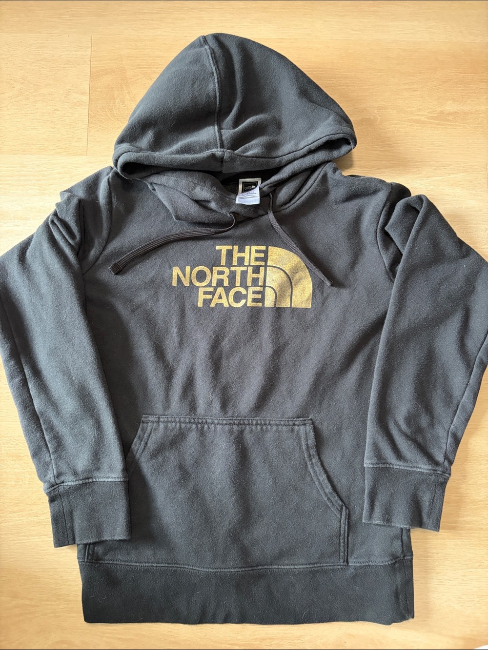 The North Face Black Hoodie with Gold Logo